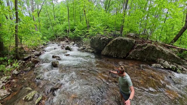 Woman Crosses Deep and Rushing River in Shenandoah National Park