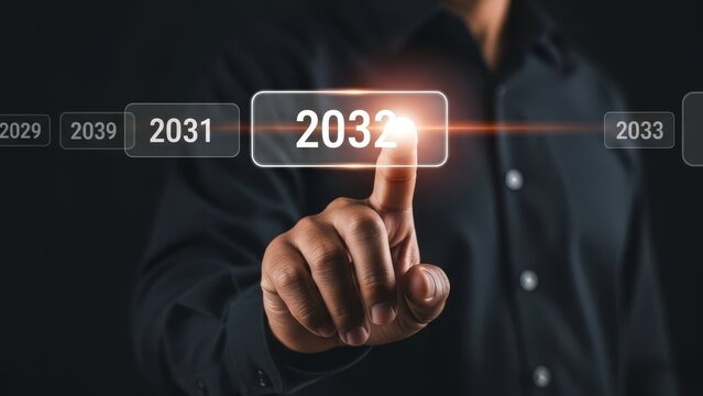 Finger selects the year 2032 on a digital display, representing forward-thinking and long-term planning strategies.