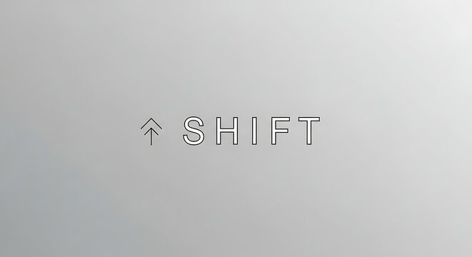 A grayscale image displaying the shift key symbol and the word shift