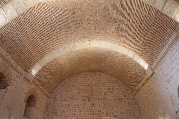 Midyat, Mardin, Turkey – August 21, 2022: Interior view of Mor Gabriel Monastery showcasing historic Syriac Orthodox architecture and stone design © aselight