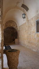 Midyat, Mardin, Turkey – August 21, 2022: Interior view of Mor Gabriel Monastery showcasing historic Syriac Orthodox architecture and stone design © aselight