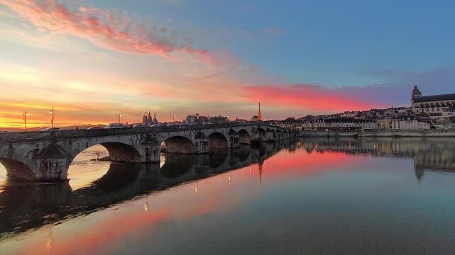 Sunset at the Jacques Gabriel Bridge across the Loire River in Blois, in France