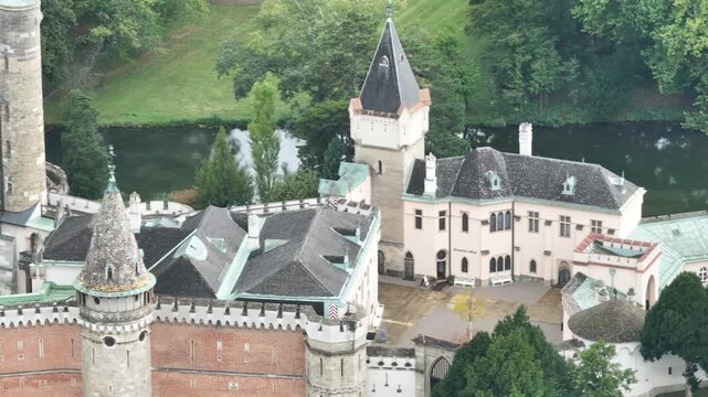 Drone aerial of Franzensburg castle by the lake Austria.
