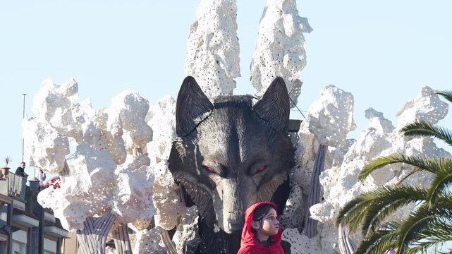 Bright afternoon procession of Viareggio Carnival floats and costumes in lively street celebration