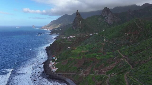 Taganana village and the Roque de Las Animas cliff. Anaga Rural Park. Canary Islands. Tenerife. Aerial video. 4K 50fps.
