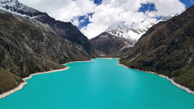 Stunning aerial view of the turquoise waters of Laguna Par&oacute;n, with snow-capped peaks of the Cordillera Blanca in Huaraz, Peru.	