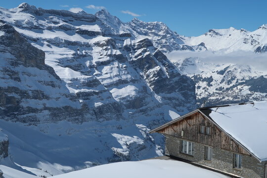 Wooden Alpine Cottage at Eigergletscher With Swiss Alps Mountain Peaks, Switzerland
