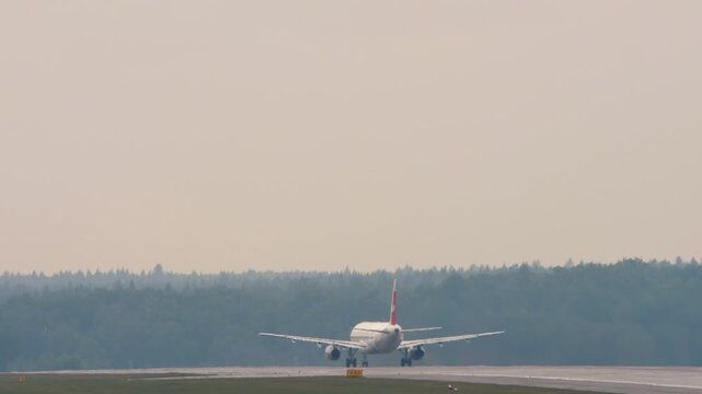 Passenger airplane take off at Moscow International airport. Tourism and travel concept. Airplane departure