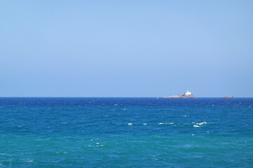 Obraz premium A lighthoise ah Horniga island, Cabo de Palos village, Spain