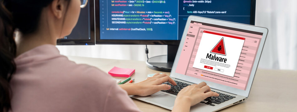 Cyber attacking concept. Malware alert showing on computer screen display scam and threat detection on computer system or online server to be removed brisk.