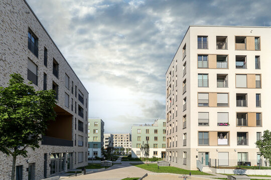 Cityscape of a residential area with modern sustainable apartment buildings, new green urban landscape in the city