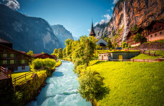 Charming alpine village in the Lauterbrunnen valley on a sunny day. Location place Bernese Alps, Switzerland, Europe.