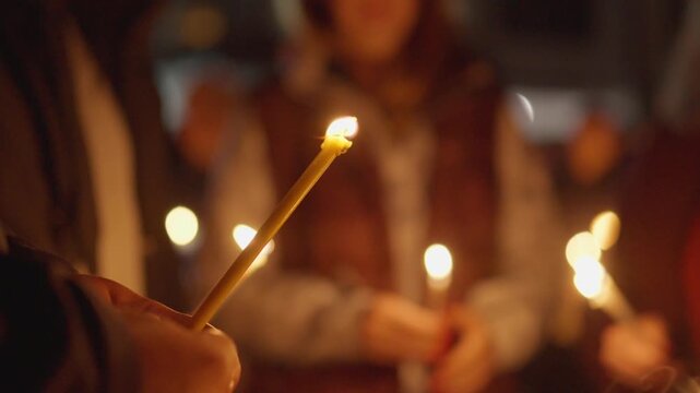 Candlelight prayer church mass gathering with people holding candles