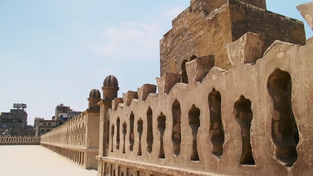 Tilt-up footage showing spiral minaret of Ibn Tulun Mosque, oldest mosque located in Islamic Cairo, Egypt 