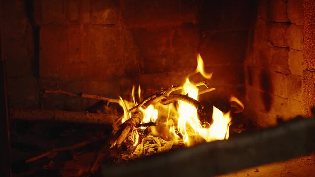 Wood burning in a cozy fireplace at home 4k footage