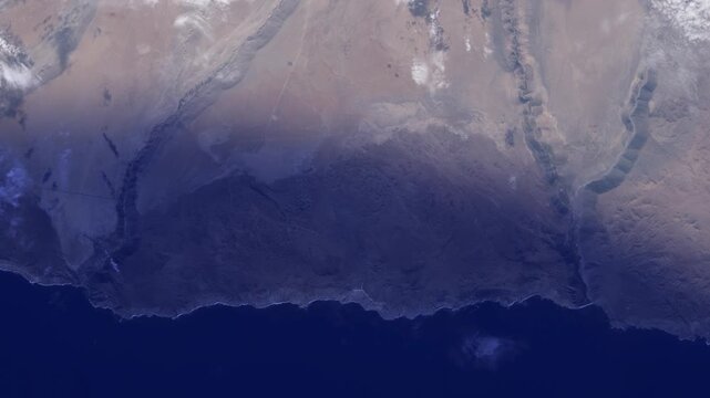 Sunrise timelapse flying over Chile Pacific Ocean coastline satellite view from space based on Nasa imagery