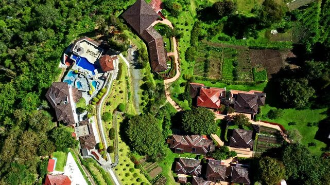 Banos, Ecuador, 1-10-2023: Aerial top view of the hotel Luna Volc&aacute;n, stunning swimming pools and a beautiful garden