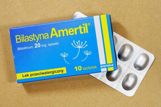 Bilastyna Amertil allergy medicine box with blister pack tablets, top view closeup of bilastinum 20 mg antihistamine packaging on cardboard background branded OTC pharmaceutical product shot no people