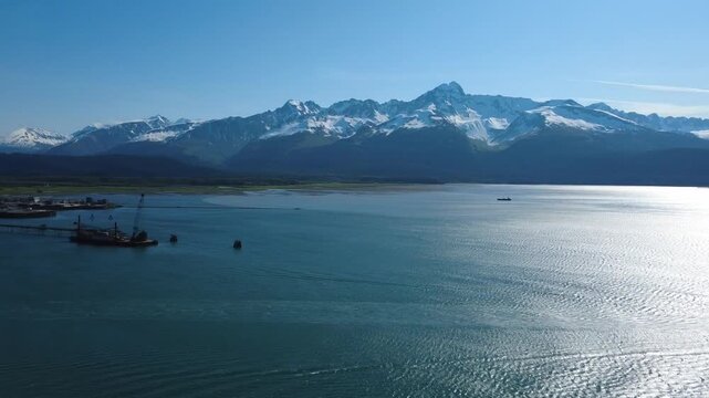 Aerial drone view of Homer Alaska coastline mountains and ocean landscape