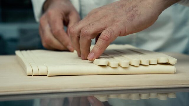 hands preparing dough for French chocolate bread