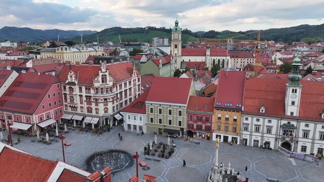 Aerial of vibrant Maribor square with colorful houses.