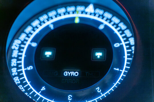 Gyro compass face extreme close-up showing degree markings on ship bridge