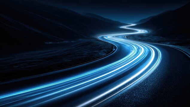 A long exposure photograph captures a winding road illuminated by vibrant blue light streaks against a dark, mountainous landscape, creating a sense of motion and mystery.