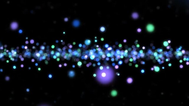 Abstract bokeh lights background with colorful glowing particles. Abstract blue and green bokeh lights shimmering against a dark black background space.