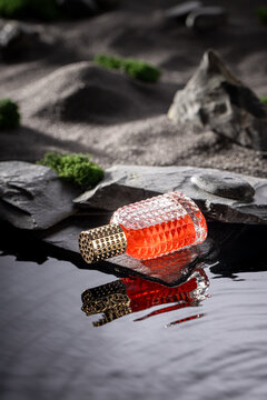 Unique red perfume in a dark stone wasteland.