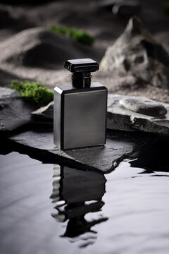 Modern golden perfume in a dark stone wasteland.