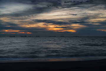 Obraz premium blue hour seascape over Melaka or Malacca Straits coastal beach and sea at Pantai Puteri
