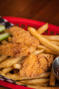 Chicken strips and fries at a restaurant as part of the children&rsquo;s meal.