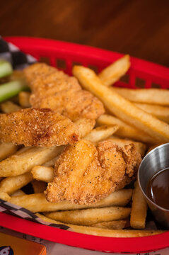 Chicken strips and fries at a restaurant as part of the children&rsquo;s meal.
