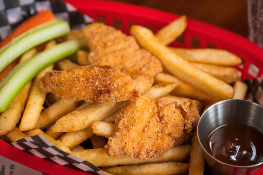 Chicken strips and fries at a restaurant as part of the children&rsquo;s meal.
