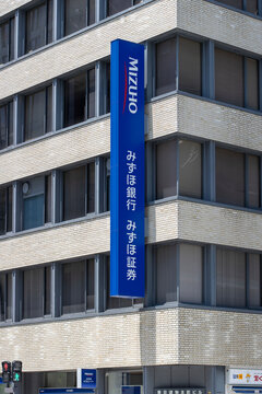 Osaka, Japan - June 29, 2025: Exterior view of a branch of Mizuho Bank and Mizuho Securities in Osaka, Japan.
