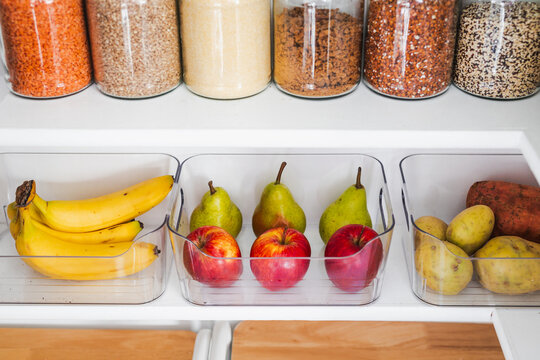 apples and pears in tidy organized pantry, healthy eating and decluttered home