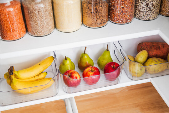 apples and pears in tidy organized pantry, healthy eating and decluttered home