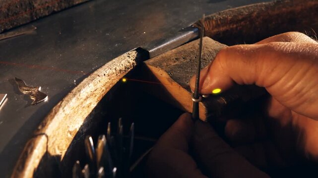 Red laser line appearing, hands adjusting collar on rod, sliding and rotating to align parts
