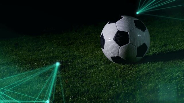 Low-angle shot: soccer ball, lasers pulsing; player kicking ball, debris scattering to show motion