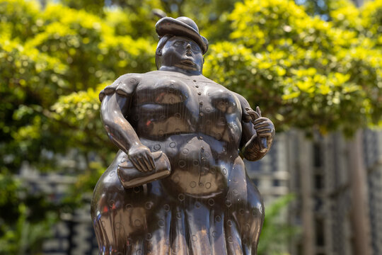 Medellin, colombia april 12, 2026, botero square botero sculpture depicting plump woman in plaza botero
