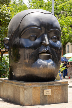 Medellin, colombia april 12, 2026, botero square botero style sculpture head in public park