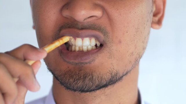 Man using miswak for traditional oral hygiene
