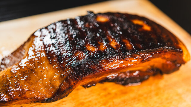 Whole pork belly chashu with a sticky glaze made from soy sauce and honey, caramelized to a dark golden crust. Juicy and tender inside, perfect for slicing and serving in ramen or Asian dishes. Clean 