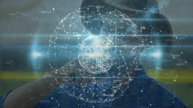 Man wearing cowboy hat holding device, holo globe materializing over face and mapping tech network