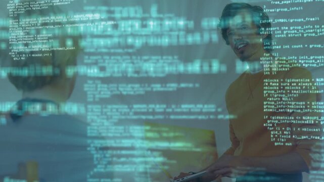 Man holding laptop and tilting screen toward coworker in office, code overlay showing software demo