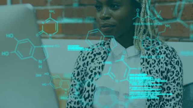 Woman leaning toward laptop while cyan holographic molecules appearing, analyzing data for research