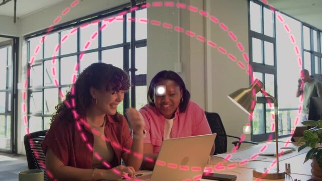 Two women using laptop, graphic appearing by right woman expanding into pink spirals showing tech