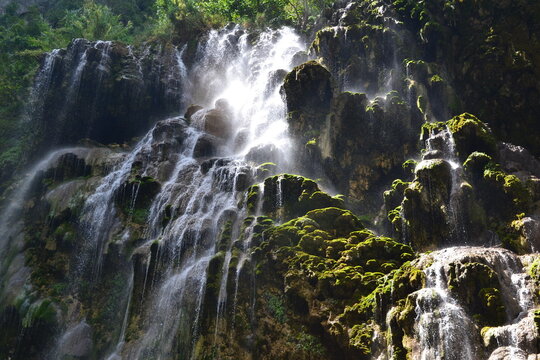 Lush cascading waterfall over mossy rocks in Tolantongo, Hidalgo, Mexico