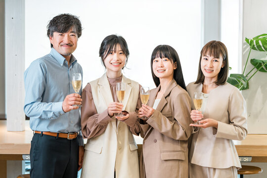 Businessmen toasting with champagne (teamwork, pep rally, victory celebration, celebration)