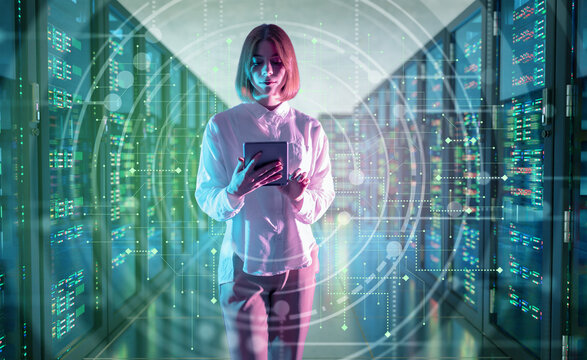 Data center management, digital monitoring. Woman uses a tablet in a server room while checking network systems, data flow and cloud infrastructure.